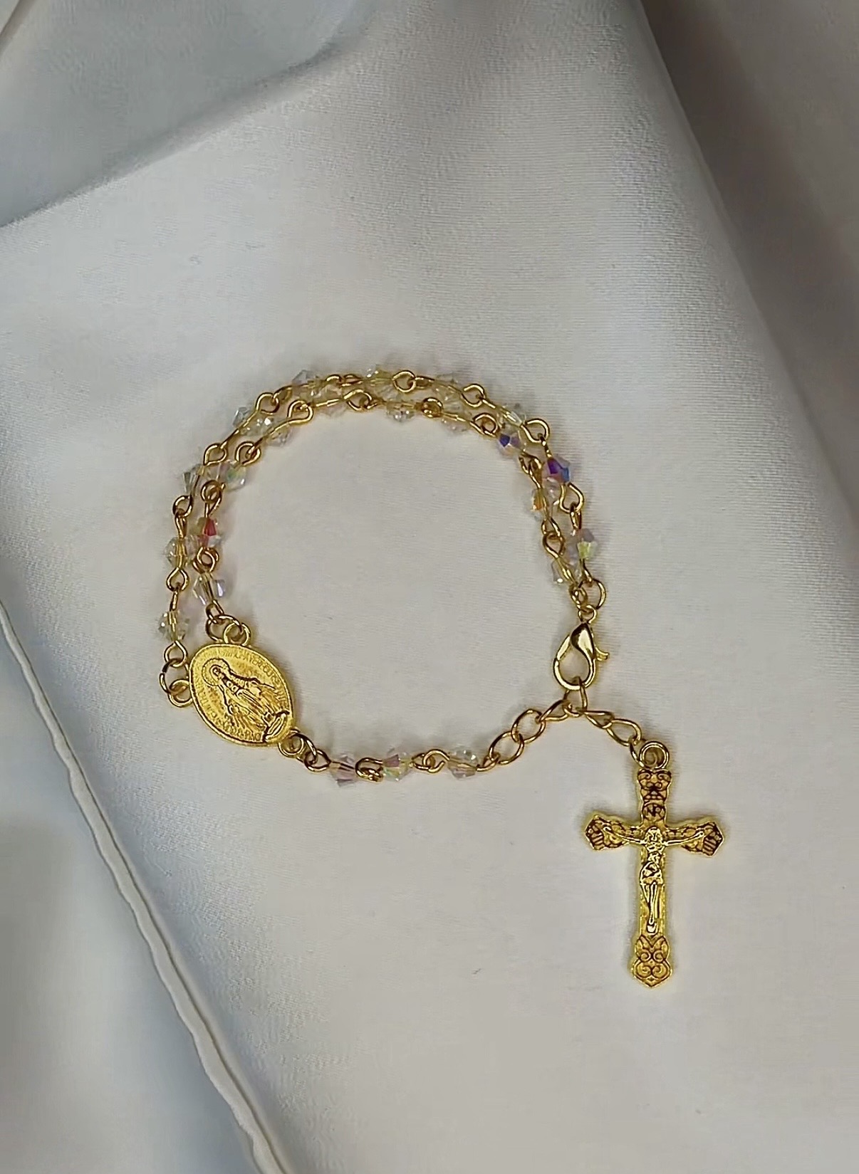 Iridescent crystal rosary bracelet in gold with Miraculous Medal and crucifix