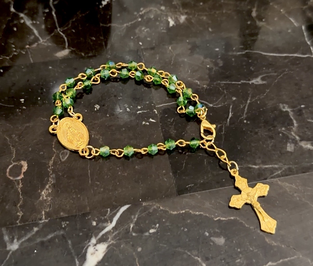 Emerald green crystal rosary bracelet in gold with Miraculous Medal and gold crucifix